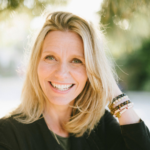 Smiling white woman with shoulder-length blond hair