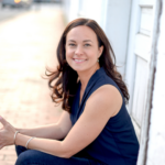 Smiling white woman with long dark-brown hair