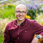 Smiling white man with glasses