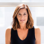 Smiling white woman with shoulder-length brunette hair