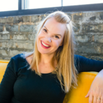 Smiling white woman with long red-blond hair